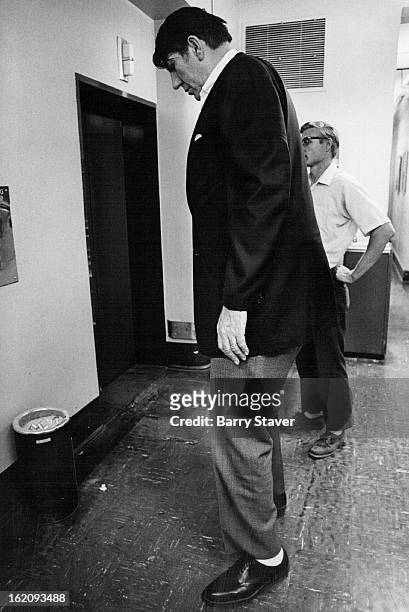 Eight-foot tall Max Palmer waits for an elevator in The Post building after an interview Friday. Palmer, one of the tallest men in the United States,...