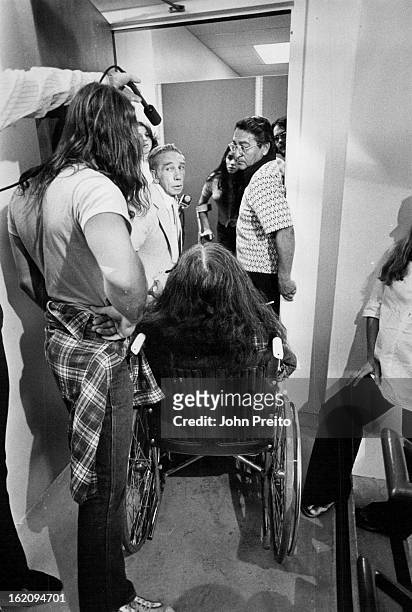 Handicapped Stage Sit-In; Handicapped persons from Atlantis Community block a doorway during their sit-in Wednesday at the offices of the Regional...