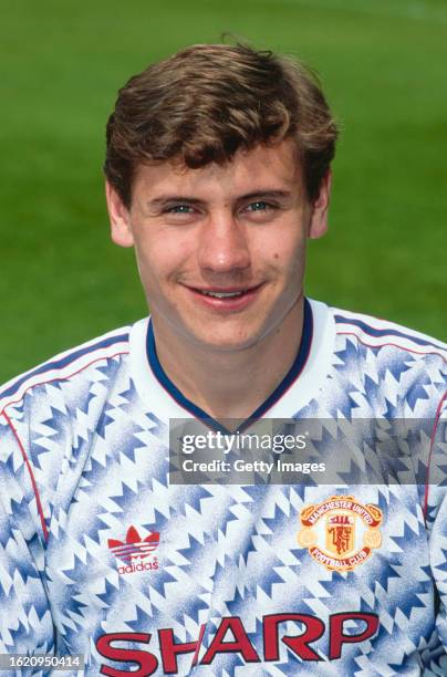 Manchester United player Andrei Kanchelskis pictured in the Blue and white Adidas away kit ahead of the 1991/92 season in Manchester, United Kingdom.