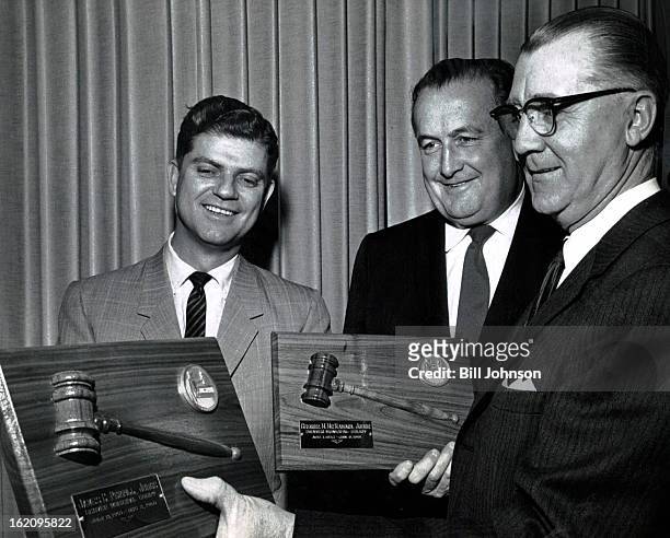 Municipal Memontos; Gerald E. McAuliffe , presiding judge of the Denver Municipal Courts, presents plaques bearing the gavels they used when they...