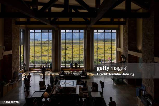 Visitors in the lobby of the Jackson Lake Lodge on August 24, 2023 at Grand Teton National Park near Jackson Hole, Wyoming. The lodge is the venue of...