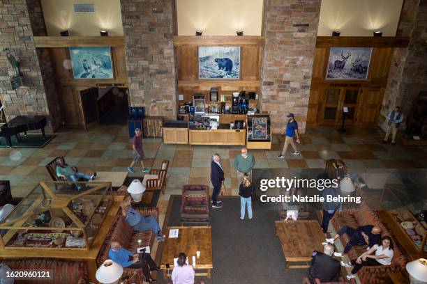 Visitors in the lobby of the Jackson Lake Lodge on August 24, 2023 at Grand Teton National Park near Jackson Hole, Wyoming. The lodge is the venue of...