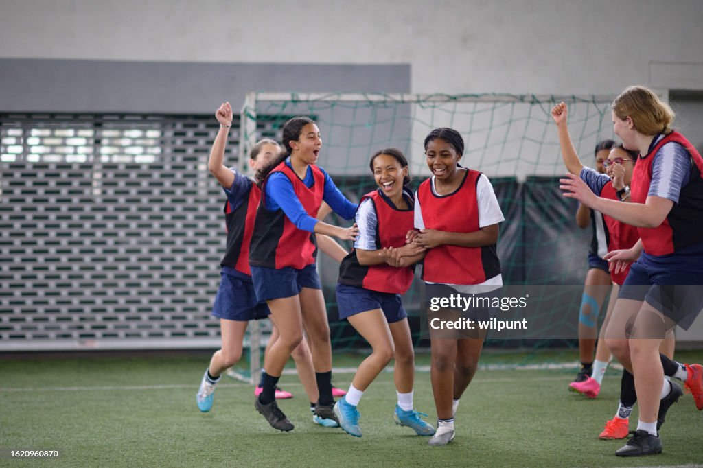 Happy Teenage Female Soccer Team Goal Celebration Run and Congratulations Cheer