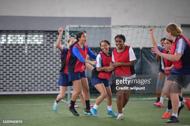 happy teenage female soccer team goal celebration run and congratulations cheer - soccer team stock pictures, royalty-free photos & images
