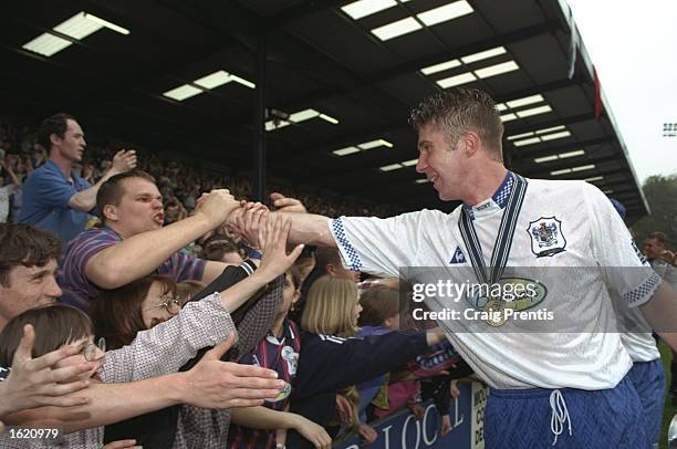 Bury celebrate winning the Nationwide Division Two Championship after the match against Millwall at Gigg Lane in Bury, England. \ Mandatory Credit:...