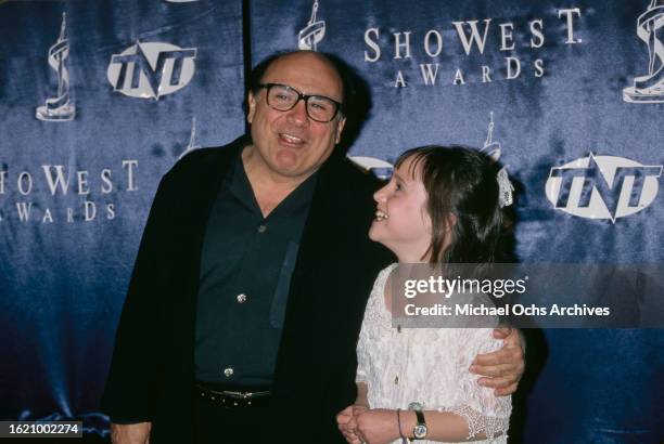 Danny DeVito and Mara Wilson attend and present at the 1997 ShoWest Awards, held at the MGM Grand Hotel in Las Vegas, Nevada, 6th March 1997.