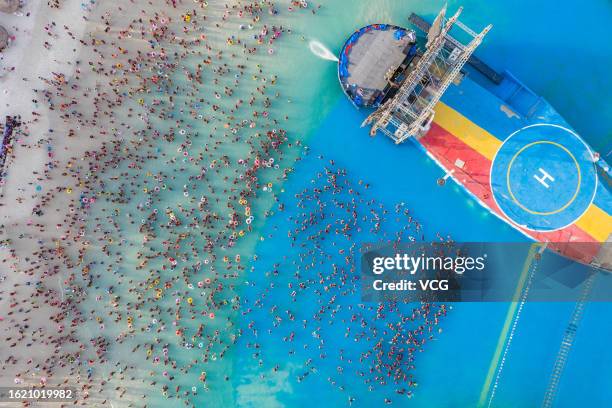 Aerial view of people cooling off at a water park on August 17, 2023 in Zhengzhou, Henan Province of China.