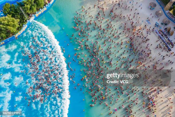 Aerial view of people cooling off at a water park on August 17, 2023 in Zhengzhou, Henan Province of China.