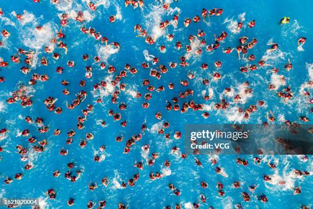 Aerial view of people cooling off at a water park on August 17, 2023 in Zhengzhou, Henan Province of China.