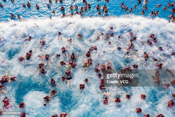 Aerial view of people cooling off at a water park on August 17, 2023 in Zhengzhou, Henan Province of China.