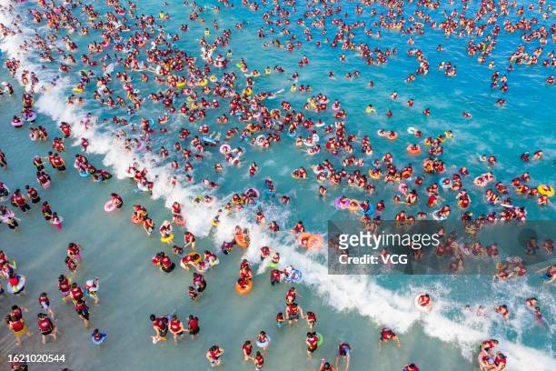 Aerial view of people cooling off at a water park on August 17, 2023 in Zhengzhou, Henan Province of China.