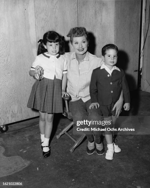 Actress Lucille Ball poses with her children Lucie and Desi Arnaz Jr, United States, circa 1950s.