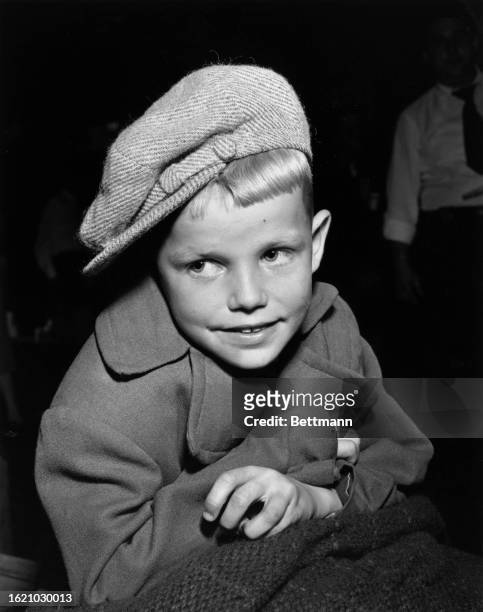 Estonian Child refugee Valdar Oinas aged 7 arrives at New York on the army transport General Raan, to eventually reach Detroit with his parents who...