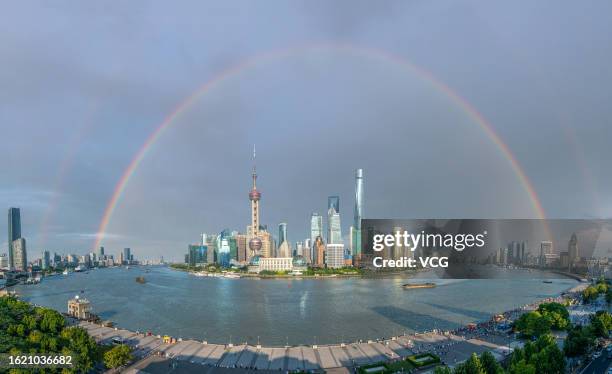 Rainbow appears in the sky above buildings at Lujiazui Financial District after a rainfall on August 17, 2023 in Shanghai, China.