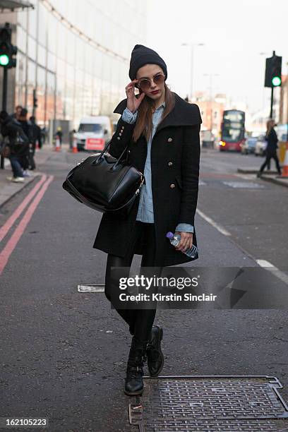 London, EnglandA model carrying a Givenchy bag on day 4 of London Womens Fashion Week Autumn/Winter 2013 on February 18, 2013 in London, England.