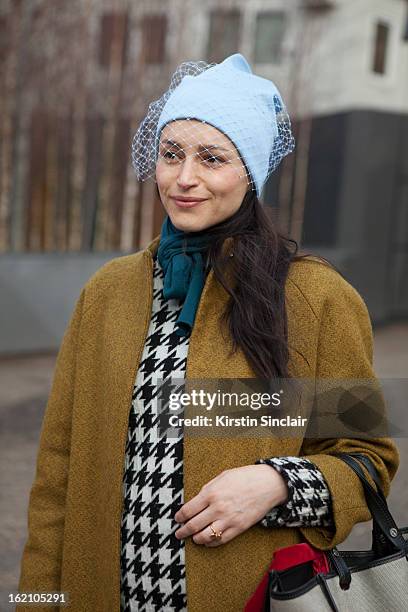 London, EnglandUrsula Geisselmnn wearing Jill Sander hat and a Cos jacket on day 4 of London Womens Fashion Week Autumn/Winter 2013 on February 18,...