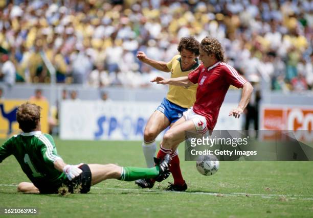 Brazil player Zico is fouled for a penalty during the 1986 FIFA World Cup Finals match against Poland on June 16th at Estadio Jalisco, Guadalajara,...