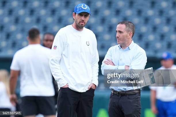 Head coach Shane Steichen of the Indianapolis Colts talks to general manager Howie Roseman of the Philadelphia Eagles during the preseason game at...