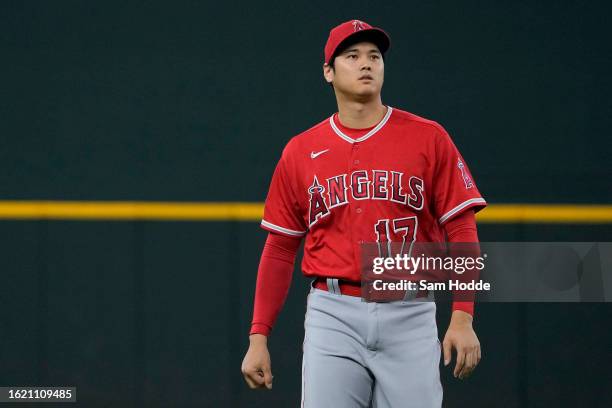 Shohei Ohtani of the Los Angeles Angels walks on the field before the game against the Texas Rangers at Globe Life Field on August 16, 2023 in...