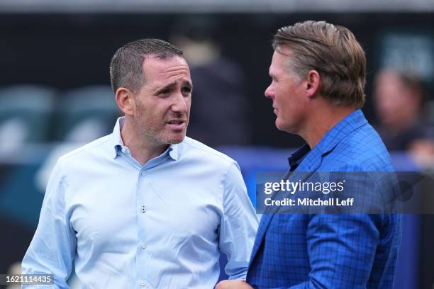 General manager Howie Roseman of the Philadelphia Eagles talks to general manager Chris Ballard of the Indianapolis Colts during the preseason game...