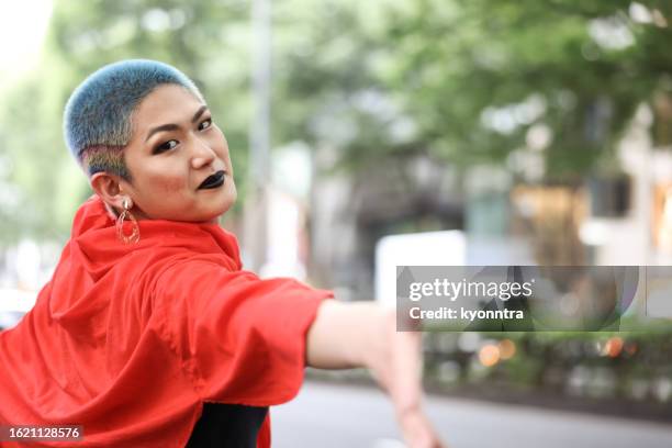 portrait of transgendered person reach out hand - harajuku stock pictures, royalty-free photos & images