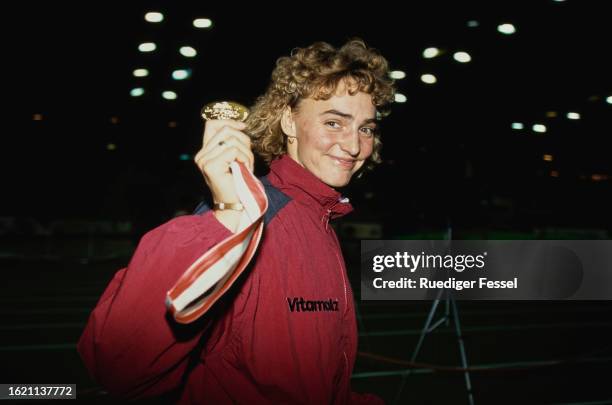 German athlete Heike Drechsler with her gold medal won in the women's long jump event at the 1994 German Indoor Athletics Championships, held at the...