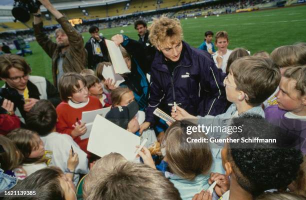 German athlete Heike Drechsler signing autographs for young fans at the International Quelle Athletics Festival in Nuremberg, Bavaria, Germany, 10th...