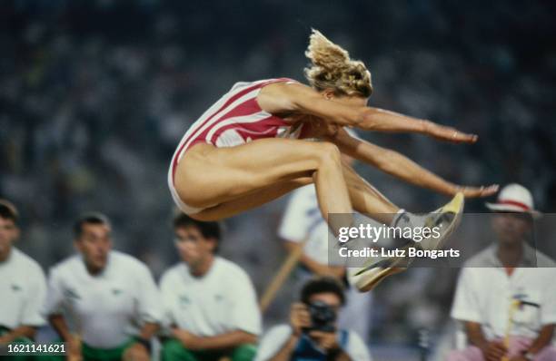 German athlete Heike Drechsler competes in the women's long jump event at the 1992 Summer Olympics, held at the Estadi Olimpic de Montjuic in...