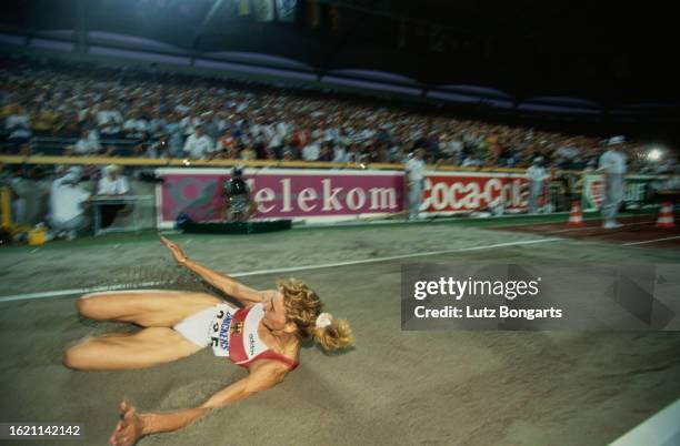 German athlete Heike Drechsler competes in the women's long jump event at the 1993 IAAF World Championships, held at the Neckarstadium in Stuttgart,...