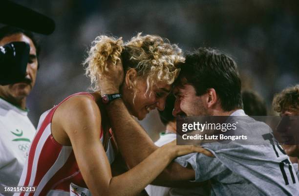 German athlete Heike Drechsler celebrates after winning gold in the women's long jump event at the 1992 Summer Olympics, held at the Estadi Olimpic...