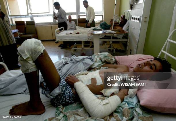 Wounded Iraqi civilian rests at a local hospital in Baghdad 31 May 2006. The civilian was injured when a bomb exploded in a crowded popular market...