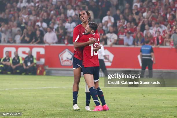 Leny Yoro of Lille OSC celebrates his goal with Remy Cabella of Lille OSC during the Europa Conference League play-off match between Lille and HNK...