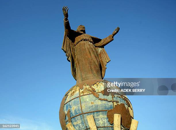 Statue of Jesus stands on a globe of the world in Dili, 12 April 2007. The 27-meter heigh statue was built with funds from the central Indonesian...