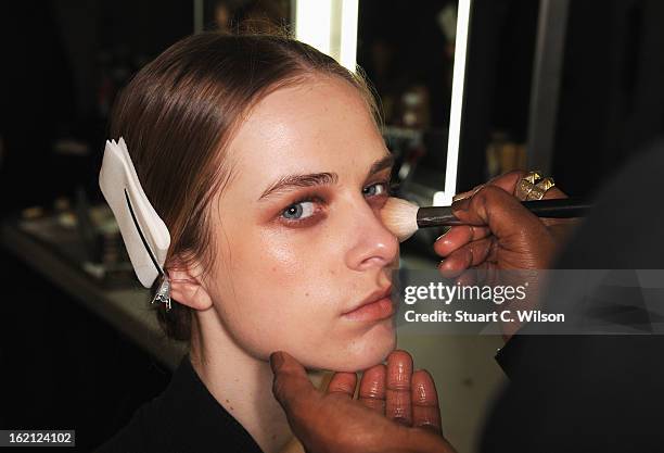 Model has her make up applied backstage at the Roksanda Ilincic show during London Fashion Week Fall/Winter 2013/14 at The Savoy on February 19, 2013...