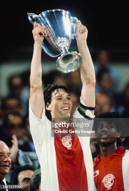 Ajax of Amsterdam striker Marco Van Basten holds aloft the trophy after the 1987 European Cup Winners Cup Final against FC Lokomotive Leipzig in...