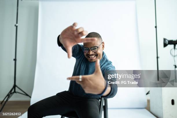 portrait of a mid adult man at studio - photo shoot set up stock pictures, royalty-free photos & images