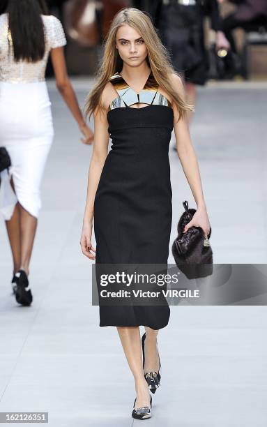 Cara Delevingne walks the runway during the Burberry Prorsum Ready to Wear Fall/Winter 2013-2014 show during London Fashion Week Fall/Winter 2013/14...