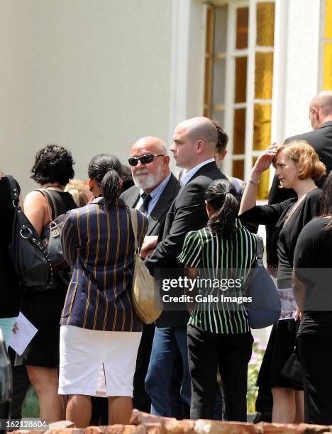 Barry Steenkamp, Reeva's father, is surrounded by family and friends as he arrives at Reeva's memorial on February 19, 2013 in Port Elizabeth, South...