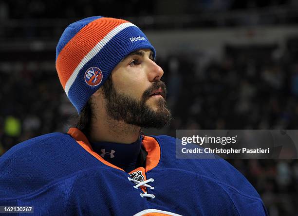 Rick DiPietro of the New York Islanders looks on during the game against the New Jersey Devils on February 16, 2013 at Nassau Veterans Memorial...