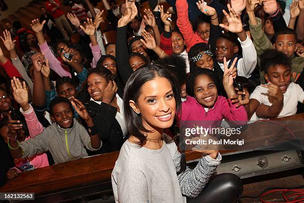 Rocsi Diaz poses for a photo with Browne Education Campus students during the Get Schooled Victory Tour on February 19, 2013 in Washington, DC.