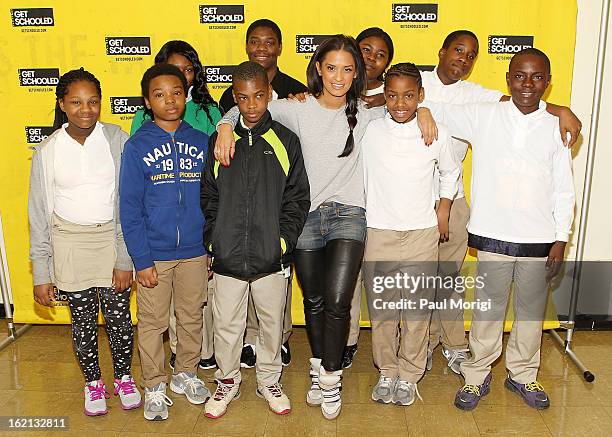 Rocsi Diaz poses for a photo with Browne Education Campus students during the Get Schooled Victory Tour on February 19, 2013 in Washington, DC.