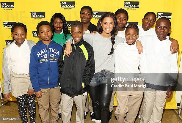 Rocsi Diaz poses for a photo with Browne Education Campus students during the Get Schooled Victory Tour on February 19, 2013 in Washington, DC.