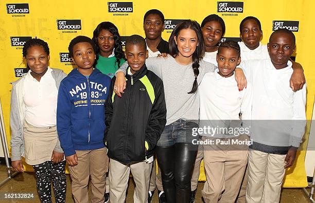 Rocsi Diaz poses for a photo with Browne Education Campus students during the Get Schooled Victory Tour on February 19, 2013 in Washington, DC.