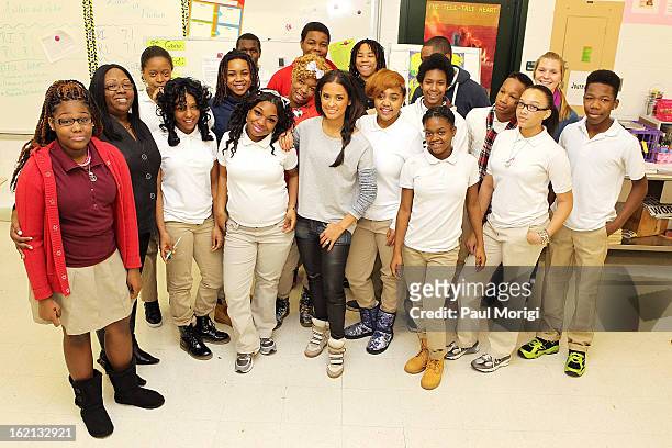 Rocsi Diaz poses for a photo with Browne Education Campus students during the Get Schooled Victory Tour on February 19, 2013 in Washington, DC.