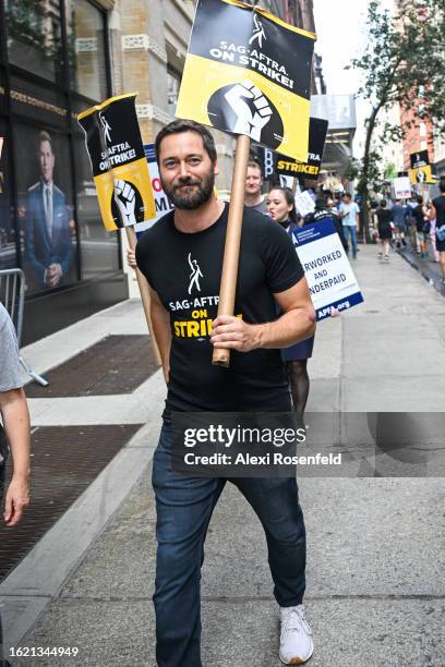 Ryan Eggold joins flight attendants, members, and supporters of the WGA and SAG-AFTRA on the picket line outside Netflix and Warner Bros. On August...