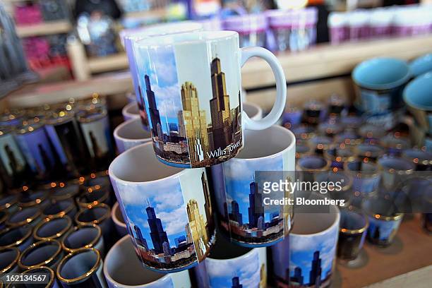 Souvenir mugs sit stacked on display for sale at the Willis Tower gift shop in Chicago, Illinois, U.S., on Wednesday, Feb. 13, 2013. Willis Tower,...
