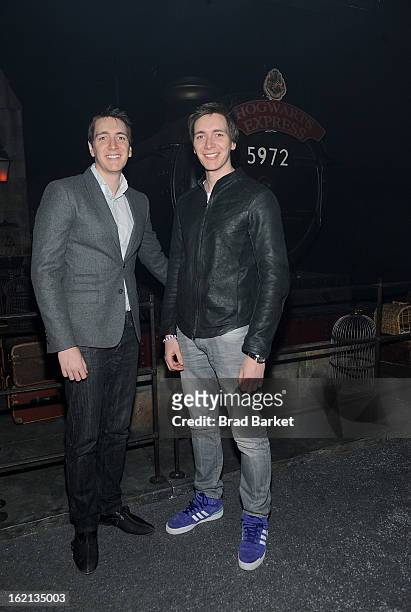 Actor Oliver Phelps and James Phelps visit The Harry Potter: The Exhibition at Discovery Times Square on February 19, 2013 in New York City.