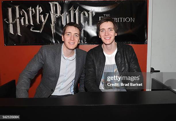 Oliver Phelps and James Phelps visit The Harry Potter: The Exhibition at Discovery Times Square on February 19, 2013 in New York City.