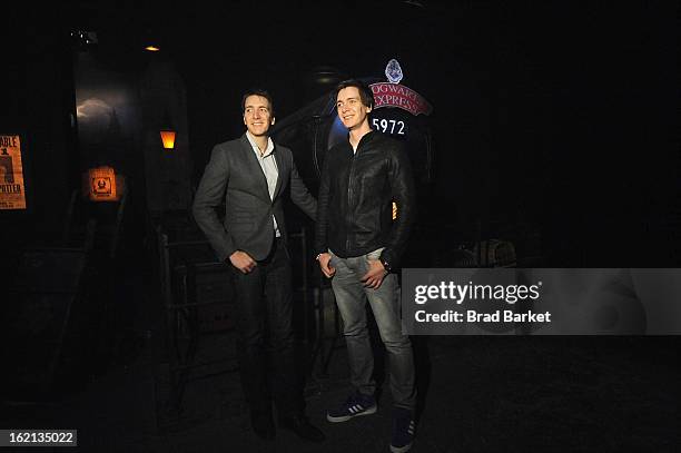 Actor Oliver Phelps and James Phelps visit The Harry Potter: The Exhibition at Discovery Times Square on February 19, 2013 in New York City.