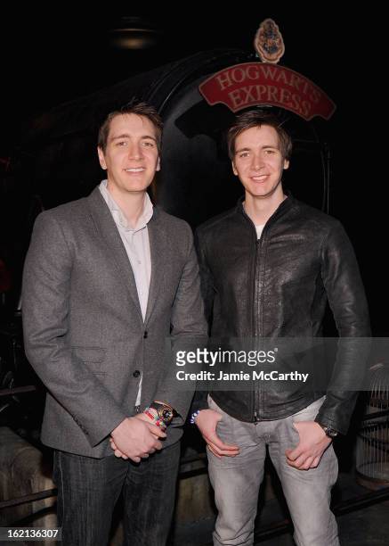 Actors Oliver Phelps and James Phelps visit The Harry Potter Exhibit at Discovery Times Square on February 19, 2013 in New York City.